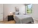 Serene bedroom with a plush bed, matching nightstands and a sunlit window at 5603 Van Bibber Ct, Golden, CO 80403
