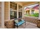 Inviting front porch features a comfortable bench, offering a relaxing outdoor space at 5603 Van Bibber Ct, Golden, CO 80403