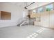 Spacious garage with ample storage cabinets, pegboard, and natural light from the windows at 5603 Van Bibber Ct, Golden, CO 80403