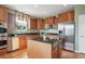 Well-appointed kitchen with stainless steel appliances, granite countertops, and a central island at 5603 Van Bibber Ct, Golden, CO 80403