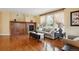 Elegant living room featuring a fireplace, wood floors, and neutral décor at 5603 Van Bibber Ct, Golden, CO 80403
