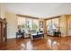 Bright living room with hardwood floors, fireplace, and large windows for ample natural light at 5603 Van Bibber Ct, Golden, CO 80403