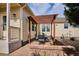 Inviting backyard patio features stylish outdoor furniture and a charming pergola for shaded relaxation at 5603 Van Bibber Ct, Golden, CO 80403