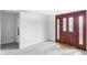 Spacious basement entry with new carpet and ample natural light from the front door at 2895 S Sherman St, Englewood, CO 80113