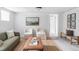 Basement space featuring modern decor, comfortable seating, and natural light at 2895 S Sherman St, Englewood, CO 80113