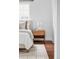 Cozy bedroom with hardwood floors, side table, and a comfy rug at 2895 S Sherman St, Englewood, CO 80113