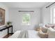 Inviting bedroom with natural light, minimalist decor, and hardwood floors at 2895 S Sherman St, Englewood, CO 80113
