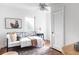 Comfortable bedroom with hardwood floors, ceiling fan, and natural light at 2895 S Sherman St, Englewood, CO 80113