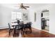 Bright dining room featuring hardwood floors, a modern table set, and direct kitchen access at 2895 S Sherman St, Englewood, CO 80113