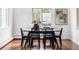 Dining room featuring hardwood floors, an elegant dining table, and natural light at 2895 S Sherman St, Englewood, CO 80113