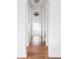 Bright hallway featuring hardwood floors and classic architecture with natural light at 2895 S Sherman St, Englewood, CO 80113