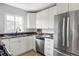 Modern kitchen with stainless steel appliances, granite countertops, and ample cabinet space at 2895 S Sherman St, Englewood, CO 80113