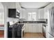 Updated kitchen featuring sleek appliances, granite countertops, and ample storage at 2895 S Sherman St, Englewood, CO 80113