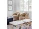 Elegant living room featuring chairs, a coffee table, and natural light at 2895 S Sherman St, Englewood, CO 80113