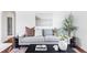 Cozy living room featuring a comfortable sofa, stylish decor and natural light at 2895 S Sherman St, Englewood, CO 80113