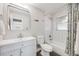 Clean bathroom with subway tiles, a modern vanity, and a shower-tub combination at 903 Poplar St, Denver, CO 80220