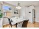 Bright dining area features a modern marble table, stylish chairs, and a large window at 903 Poplar St, Denver, CO 80220