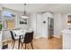 Cozy dining area with modern table and chairs, stainless steel refrigerator, and natural light at 903 Poplar St, Denver, CO 80220