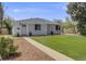 Charming single-story home with a well-manicured lawn and inviting front entrance at 903 Poplar St, Denver, CO 80220