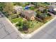 Aerial view of the property showcasing the landscaped yard, neighboring houses and street at 998 S Leyden St, Denver, CO 80224
