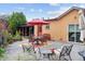 Backyard deck with table, chairs, and a red umbrella at 998 S Leyden St, Denver, CO 80224