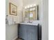 Bathroom vanity with marble countertop and decorative mirror at 998 S Leyden St, Denver, CO 80224