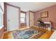 Bedroom with light-wood floors, a colorful rug, and a work desk at 998 S Leyden St, Denver, CO 80224