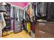 Walk-in closet with a variety of clothing and storage solutions, including drawers and shoe racks at 998 S Leyden St, Denver, CO 80224