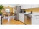 Bright kitchen featuring stainless steel appliances, light counter tops, and hardwood floors at 998 S Leyden St, Denver, CO 80224
