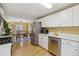 Open concept kitchen with stainless appliances and dining area at 998 S Leyden St, Denver, CO 80224