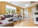 Bright living room with a large window, modern decor, and a comfortable gray sectional sofa at 998 S Leyden St, Denver, CO 80224