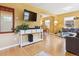 Open living space with warm yellow walls, hardwood floors, and stylish furnishings at 998 S Leyden St, Denver, CO 80224