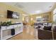 Open concept living room with hardwood floors, large TV and comfortable seating area at 998 S Leyden St, Denver, CO 80224
