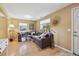Inviting living room with large windows, cozy seating and hardwood floors at 998 S Leyden St, Denver, CO 80224