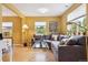 Cozy living room showcasing a comfortable sectional, a stylish glass coffee table, and natural light at 998 S Leyden St, Denver, CO 80224
