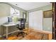 Bright office with a white desk, sliding closet doors, and carpet at 998 S Leyden St, Denver, CO 80224