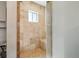 Shower with tan tile and built-in bench at 998 S Leyden St, Denver, CO 80224