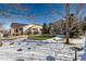 Winter backyard view, putting green, patio, and solar panels at 1429 S Grand Baker Cir, Aurora, CO 80018