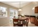 Eat-in kitchen area with table and chairs near sliding glass door at 1429 S Grand Baker Cir, Aurora, CO 80018