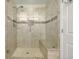 Large walk-in shower with glass enclosure and tiled walls at 1429 S Grand Baker Cir, Aurora, CO 80018