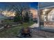 Enjoy an evening fire in this backyard, complete with a fire pit and covered patio with outdoor seating at 1831 Ashford Cir, Longmont, CO 80504