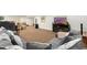 Basement living space with sectional sofa, TV, and neutral colored carpet at 1831 Ashford Cir, Longmont, CO 80504
