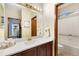 Bathroom with a single vanity, light wood cabinets, gold hardware, and a shower/tub combination at 1831 Ashford Cir, Longmont, CO 80504