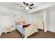 This bedroom features neutral walls, a ceiling fan, and an eye-catching beige bed set and other furniture at 1831 Ashford Cir, Longmont, CO 80504
