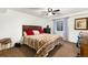 Bedroom with a rustic bed frame, modern accents and wood floors at 1831 Ashford Cir, Longmont, CO 80504
