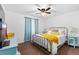 A modern bedroom featuring stylish furnishings, a ceiling fan, and a calming color palette at 1831 Ashford Cir, Longmont, CO 80504