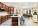 Charming kitchen featuring an island, modern appliances, and an adjacent dining area at 1831 Ashford Cir, Longmont, CO 80504