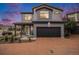 Charming two-story home with a paved driveway and well-manicured landscaping at 17996 E 54Th Ave, Denver, CO 80249