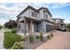 Attractive two-story home with an attached garage, covered front porch and beautiful landscaping at 17996 E 54Th Ave, Denver, CO 80249