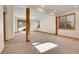 Large and open basement with natural light, wooden beams, and potential for customization at 1294 Red Lodge Dr, Evergreen, CO 80439